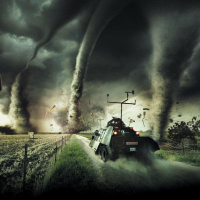 A storm vehicle tears through a road full of tornadoes.