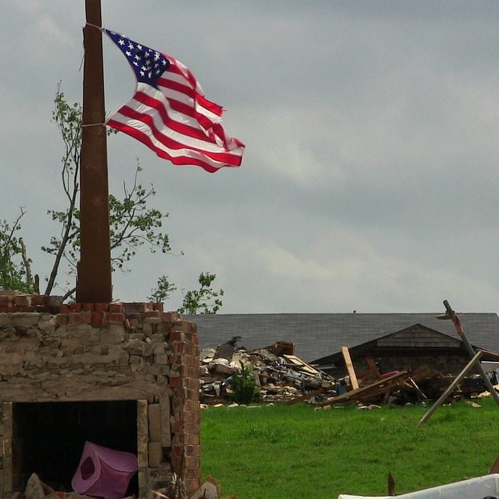 American Flag flying over Tornado damaged home